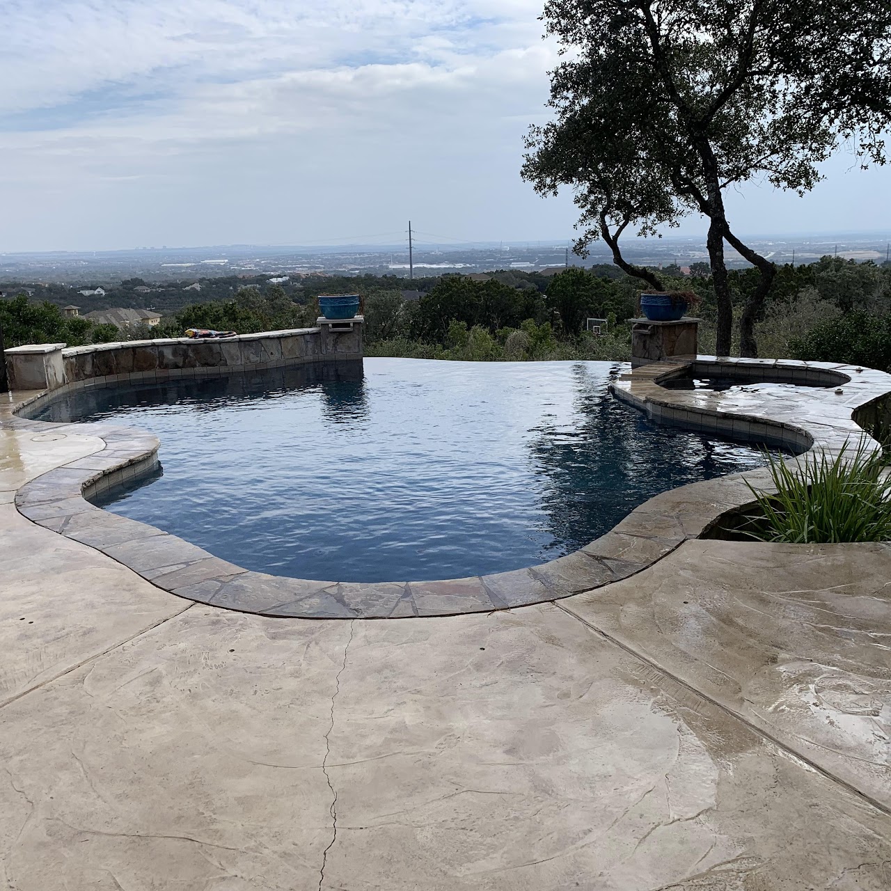 Stunning infinity edge pool remodel overlooking hill country